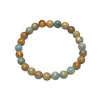 The Ocean bracelet featuring striking 8mm blue violet sea sediment imperial jasper gemstones on durable stretch cord.