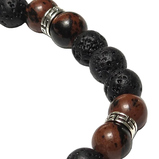 Black Terra bracelet featuring 8mm black lava rock and mahogany obsidian crystal beads with 90s tribal silver findings on a white background.