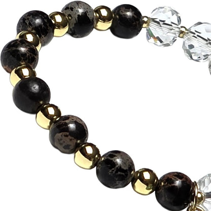clear glass and black patterned bead brace with gold beads