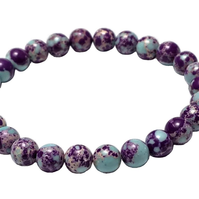 Purple and blue galaxy imperial jasper sea sediment bead bracelet by Fancyness Revival.