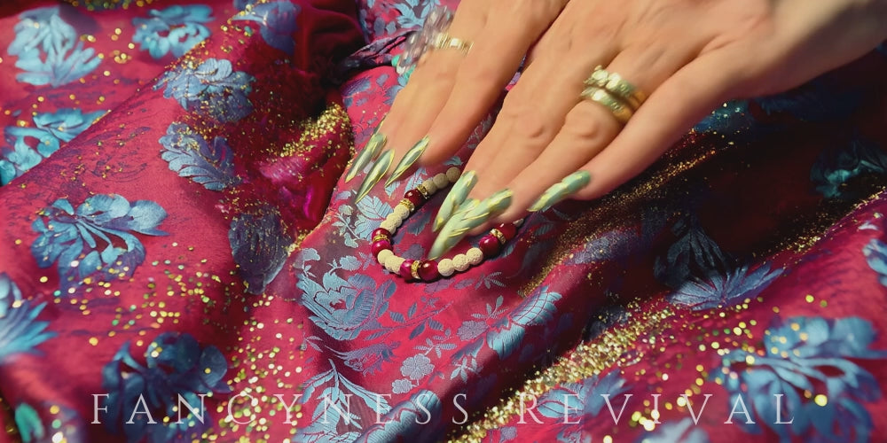 Load video: hands giving reiki to a bracelet with sparkles in the background
