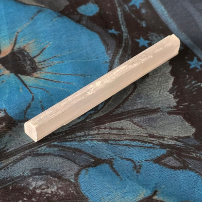 white gemstone wand shaped