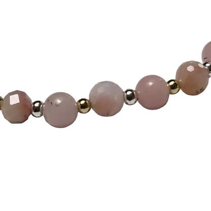 pink bead bracelet with gold and silver accents