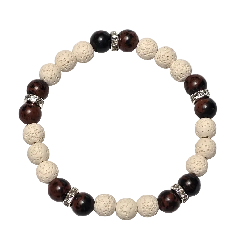 White Terra bracelet featuring 8mm white lava rock and mahogany obsidian beads with silver plated rhinestone rondelles.
