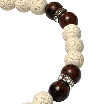 Close up view of the textured white lava rock and sparkling silver plated rhinestone rondelles on the Reiki infused White Terra bracelet.